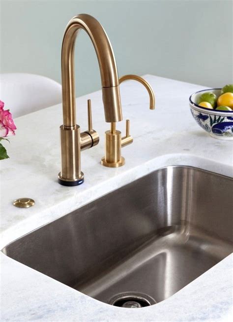 stainless sink with gold faucet